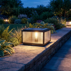 Cassia pillar light on a low garden wall at dusk