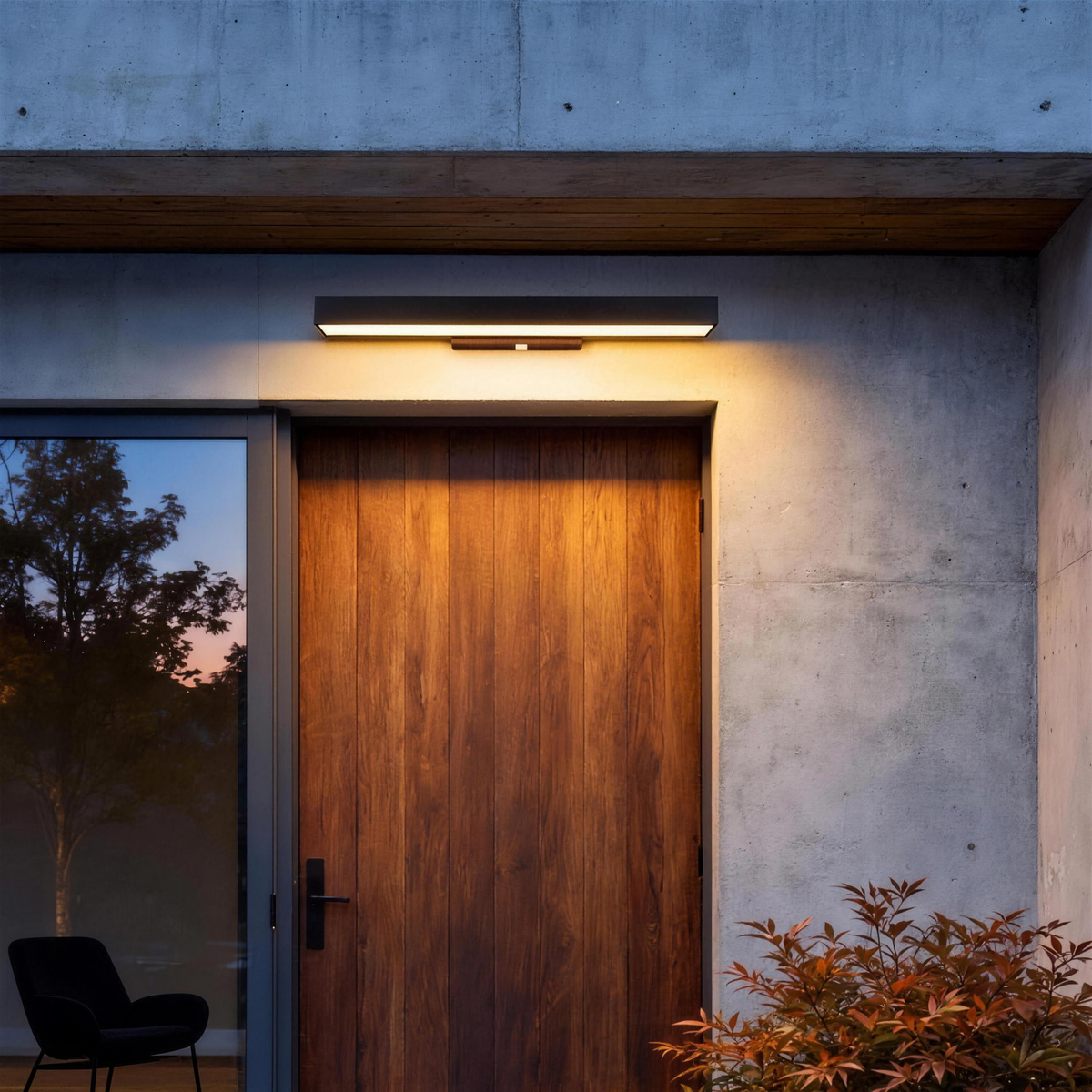 Vantia wall light above a wooden front door at dusk