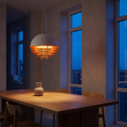 Solera pendant light over a dining table at dusk