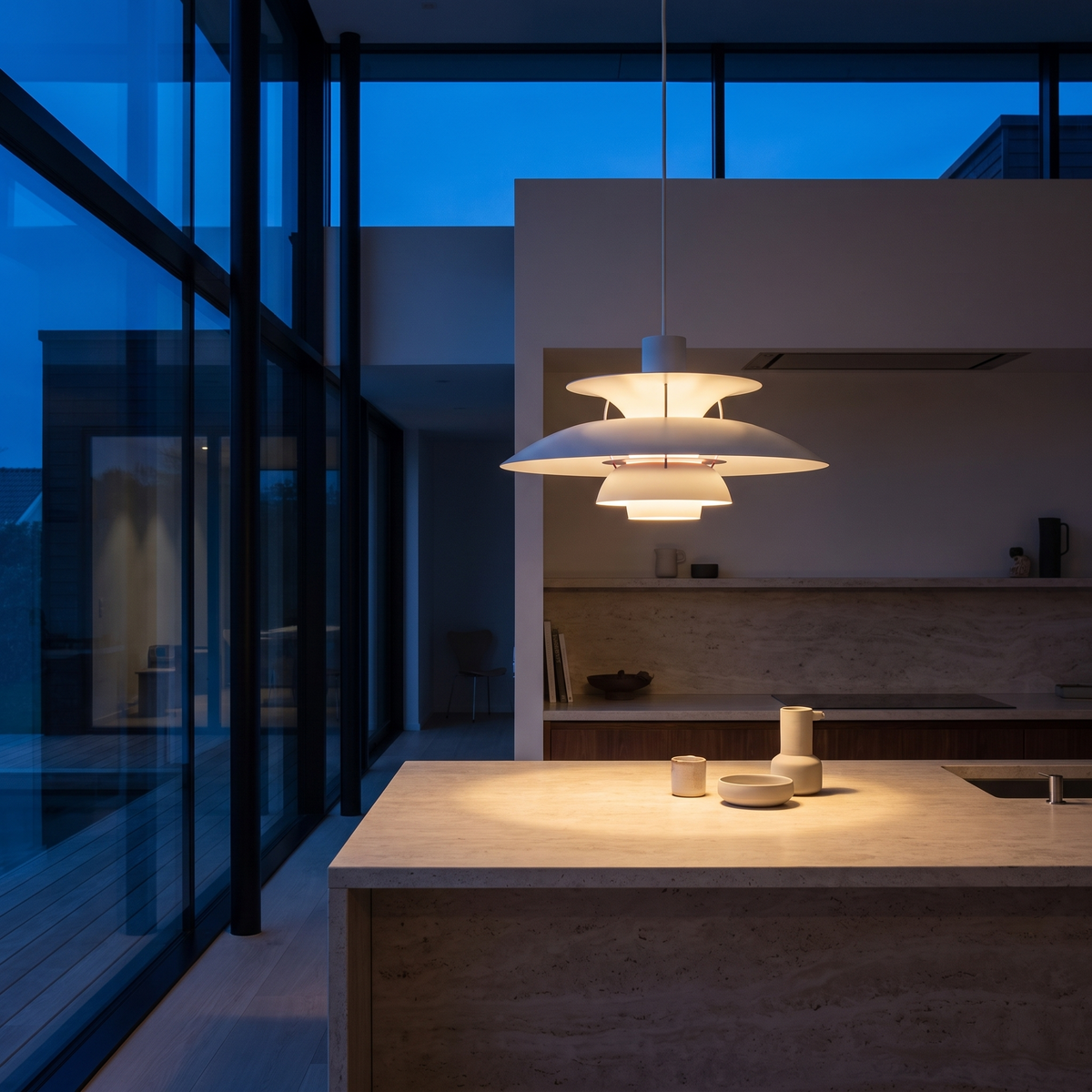 Halden pendant light over a kitchen island at dusk