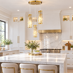 Gold crystal pendant light over marble kitchen island
