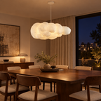 White fabric cloud pendant light above a dining table in a modern dining room