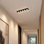 Recessed frameless linear LED downlight in a hallway ceiling