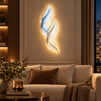 Backlit feather wall decor light above a sofa in a living room
