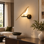 Gold bird wall light with glass bird on a living room wall