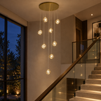 Long crystal globe staircase chandelier in a staircase stairwell