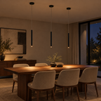 Thin black cylinder LED pendant light above a dining table in a modern dining room