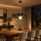 Acoustic felt pendant light above a dining table in a modern dining room