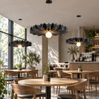 Acoustic felt pendant lights above cafe tables