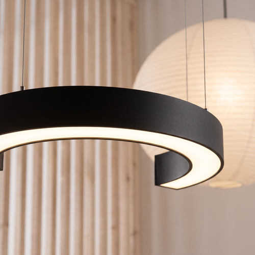 Arca C-shaped LED pendant light close-up detail lit up