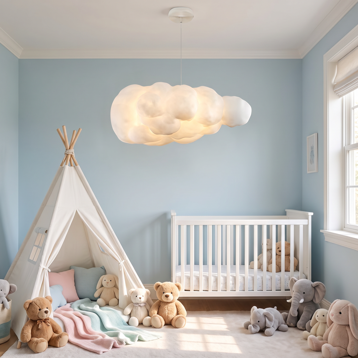Nimbus cloud pendant light hangs in a dreamy nursery playroom with soft pastel blue walls