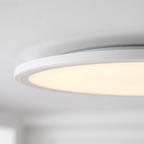 Disc ultra-thin round LED ceiling panel light close-up detail lit up