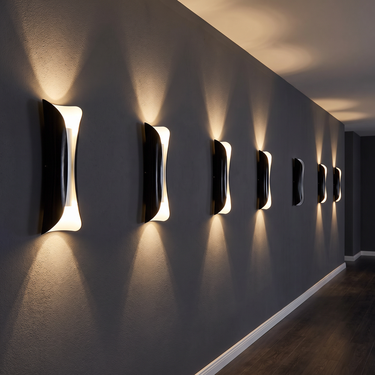 Beam up-and-down LED wall light a row of them mounted on a dark grey hallway wall