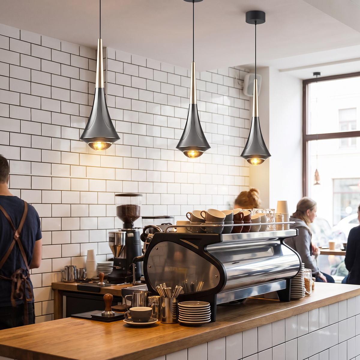 Cono mini cone pendant light three hang in a row over a cafe coffee bar counter with white subway tiles