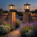 Corvin solar outdoor pillar cap light sits on top of the brick pillars of a garden gate along a stone path with lavender
