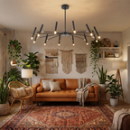 Branch adjustable sputnik LED chandelier hangs in an eclectic boho living room with lots of plants