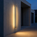 Lumea wall light on a concrete entrance wall at blue hour